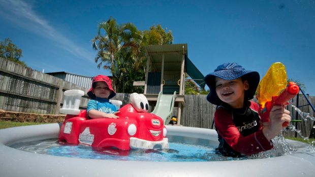 Three-year-old Daniel (left) and five-year-old Matthew (right) escaping the heat wave and enjoying the paradise of their ...