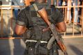 An Ivory Coast troop provides security before the arrival of incumbent President Alassane Ouattara.