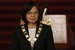 Taiwan's President Tsai Ing-wen poses for photos after she received Guatemala's highest honor "Orden del quetzal," at the National Palace in Guatemala City, Wednesday, Jan. 11, 2017.