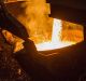 Molten copper flows from a furnace into a ladle at the Aurubis AG metals plant in Hamburg, Germany.