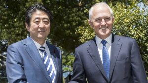 Japanese Prime Minister Shinzo Abe is greeted by the Australian Prime Minister Malcom Turnbull on arrival at Kirribilli ...