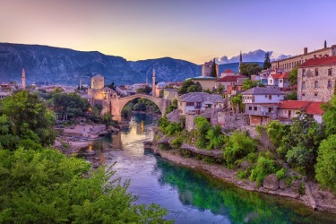 The old Mostar Bridge is Bosnia & Herzegovina has long been a symbol of Christianity & Islam united together as a ...