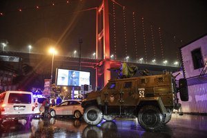 In this Sunday, Jan. 1, 2017 file photo, a police armoured vehicle blocks the road leading to the scene of an attack in Istanbul.