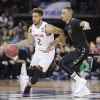 Maryland guard Melo Trimble (2) drives against Hawaii guard Quincy Smith (11) during the first half of a second-round men's college basketball game in the NCAA Tournament in Spokane, Wash., Sunday, March 20, 2016. (AP Photo/Young Kwak)