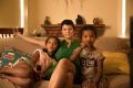 Kylie Carville with her daughters Nimu and Ciku at their Coburg home. 