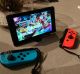 When detached from the console, the Joy-Con can be fitted with straps that make them comfier to hold and stop you ...