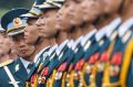 An officer checks the alignment of the honour guard before a welcoming ceremony for Japan's Prime Minister Shinzo Abe in ...