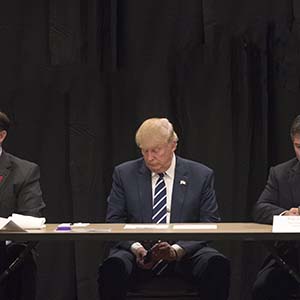 Donald Trump is interrupted by a phone call during a meeting with specialists on the problem of opiate addiction, after a campaign event in Manchester, N.H., Oct. 28, 2016. Trump on Friday seized on the FBI's announcement that it had uncovered new emails related to the investigation into whether Hillary Clinton had mishandled classified information. (Stephen Crowley/The New York Times/Redux)