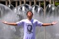 English student Keanu Audabram from New Caledonia cools down at the fountain on Spring Street.