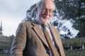 Conductor Richard Divall outside  Melbourne University's Newman College dome.