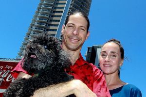 Patty Huntington with her partner Kent Vaughan and dog Astro Boy, outside their apartment block the Elan.