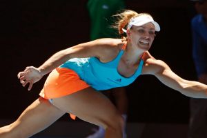 Germany's Angelique Kerber reaches for a forehand return to compatriot Carina Witthoeft during their second round match ...