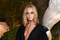 Cara Delevingne wearing Burberry at the Burberry September 2016 show during London Fashion Week SS17 at Makers House on ...