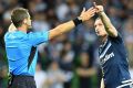 Besart Berisha argues his case with referee Chris Beath.