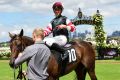 Ben Thompson returns after riding Double Bluff to win at Flemington on Saturday.