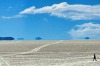 A tourist is seen walking along the salt flats at the Uyuni salt flats, Bolivia.