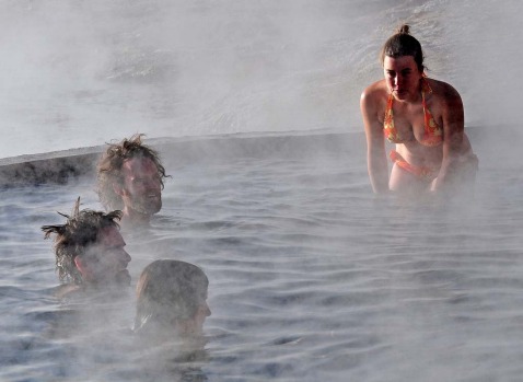 Tourists bathe in hot springs near the small village of Agua Brava, more than 4000 meters above sea level, in the Uyuni ...