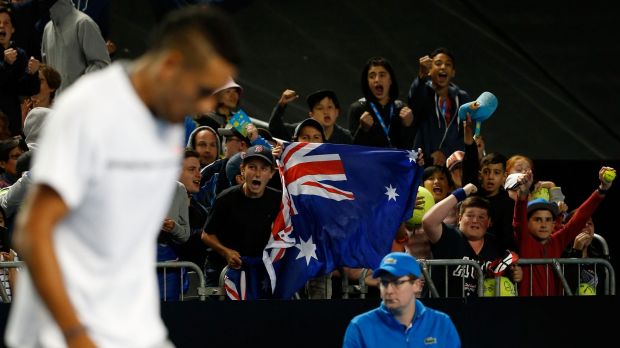 Fans cheer on a desolute Kyrgios.