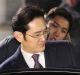 Lee Jae-yong, a vice-chairman of Samsung Electronics, gets into a car as he leaves after a Seoul court denied a request ...