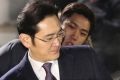 Lee Jae-yong, a vice-chairman of Samsung Electronics, gets into a car as he leaves after a Seoul court denied a request ...