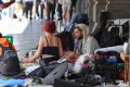 Homeless people at the encampment along Flinders Street.