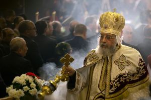 Coptic Pope Tawadros II leads Christmas Eve Mass at St. Mark's Cathedral, in Cairo, Egypt, late Friday, Jan. 6, 2017. ...