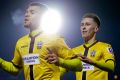 Sutton United's Maxime Biamou, left, celebrates after scoring his side's second goal.