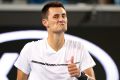 Bernard Tomic gives the thumbs up. 