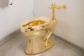 The18-karat gold toilet is shown in the museum's 14th floor restroom.