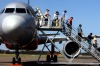 Passengers always board and disembark planes from the left hand side.