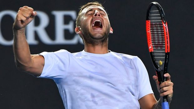 A perspiring Dan Evans celebrating his win over Marin Cilic.