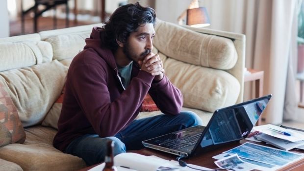 Dev Patel as Saroo Brierley, obsessing searching for his birth mother using Google Earth, in <i>Lion</i>.