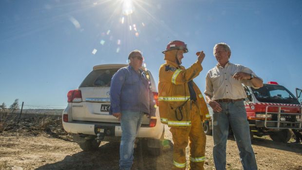 Mulloon Creek Natural Farms owners Tony Coote, Gary Nairn and Michael Fitzgerald assess the damage to their property.