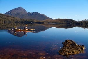 Paddling through Forest Lagoon at the edge of Bathurst Harbour, with Mount Rugby behind.