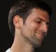 Novak Djokovic of Serbia reacts in his second round match against Denis Istomin of Uzbekistan.