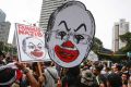 Student activists hold up a caricature of Malaysian Prime Minister Najib Razak in Kuala Lumpur in August.