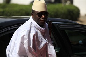 FILE- In this Thursday, Feb. 27, 2014, file photo, Gambia's President Yahya Jammeh arrives for a summit to address a seminar on security during an event marking the centenary of the unification of Nigeria's north and south in Abuja, Nigeria. Heavy gunfire is reported Tuesday Dec. 30, 2014, near the presidential palace in Gambia, according to local residents, raising the specter of a coup attempt while the longtime ruler is currently visiting France, state media reported. On Tuesday, soldiers linked to his presidential guard were believed to be involved in the fighting, according to witnesses who spoke on condition of anonymity for fear of reprisals.