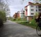 A woman cycles down a street in the suburb of Vauban, on the outskirts of Freiburg. Residents of this experimental new ...