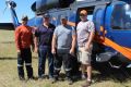 Brandon Hahaj, Fergus Frater, Brian Jorgenson and Brady Schaures stand in front of the UH60A Black Hawk at Goulburn ...