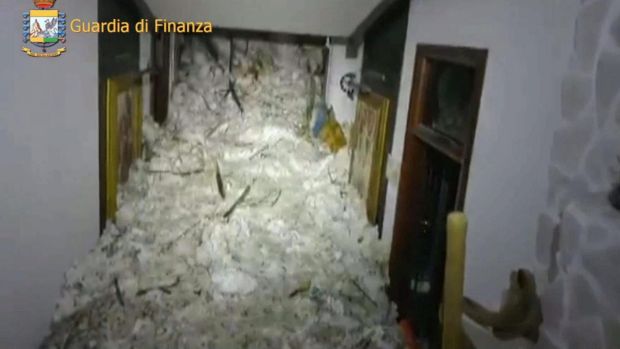 This image made available by the Italian Guardia di Finanza finance police shows the avalanche inside the Rigopiano ...