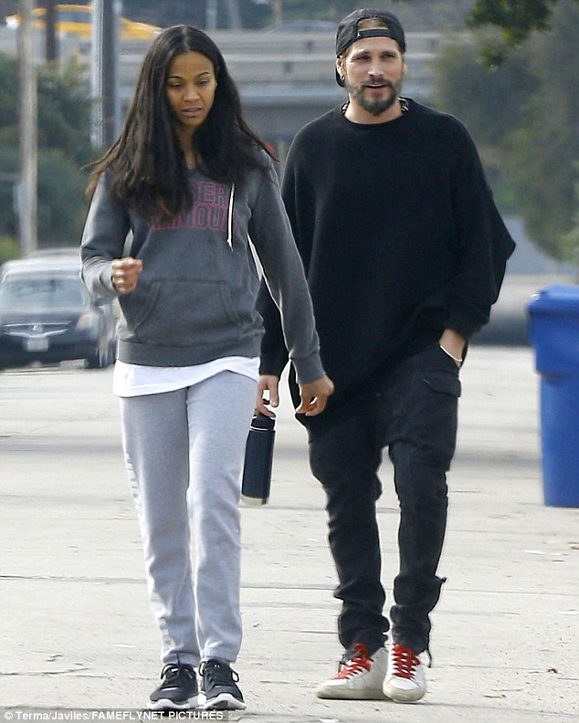 Strong bond: Zoe Saldana and her husband Marco Perego were seen on a casual stroll  in Glendale, California on Wednesday