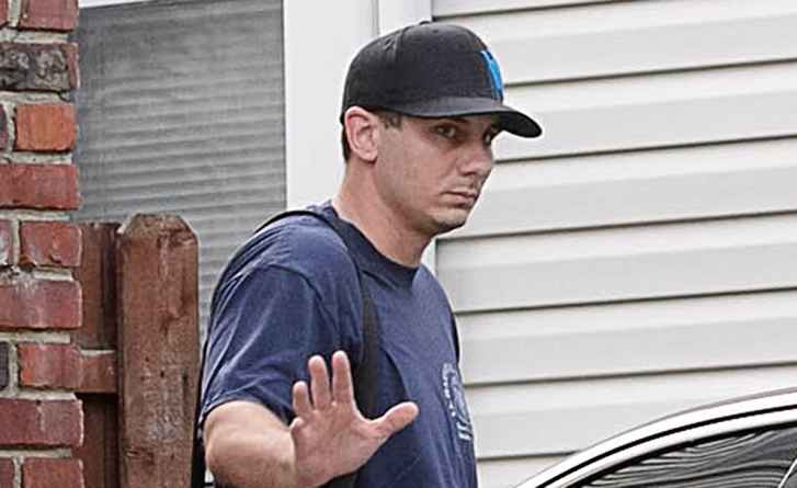 GARDNERONEYEAR - NYPD Officer Daniel Pantaleo is seen waving to officers assigned to protect him as he leaves his Staten Island home on Thursday, July 2, 2015. (Jeff Bachner/New York Daily News)