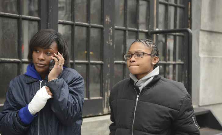 Akirah Taylor (with bandaged hand) and Breeyana Burkett allege that two NYPD officers falsely detained and arrested them for truancy as they were leaving a bodega that holds phones for students during school hours.  The bodega in question was at the end of the very block on which Cobble Hill School for American Studies is located, but the girls were arrested despite their explanation that they were literally half a block from school.