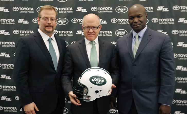 New York Jets owner Woody Johnson, center, poses for photographers with the NFL football team's new general manager Mike Maccagnan, left, and new head coach Todd Bowles during press conference, Wednesday, Jan. 21, 2015, in Florham Park, N.J. (AP Photo/Julio Cortez)