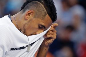 Australia's Nick Kyrgios wipes his face while playing Italy's Andreas Seppi during their second round match at the ...