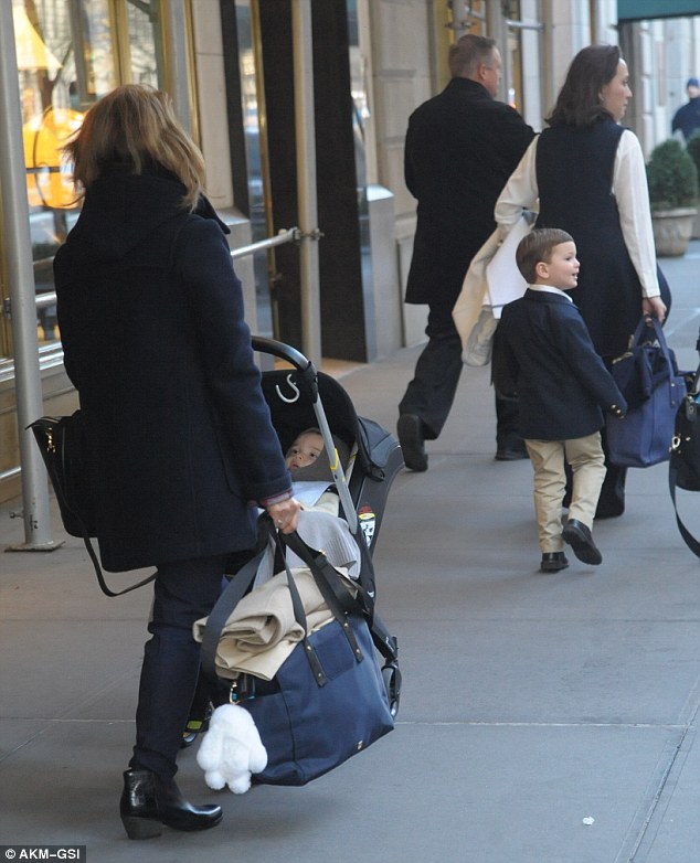 All together: The couple's sons, three-year-old Joseph and nine-month-old Theodore, were also photographed leaving the building with their nannies 