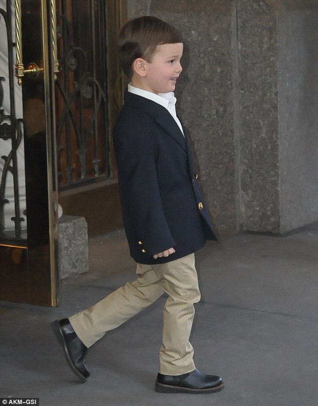 Mini-me: Joseph looked like the spitting image of his father in a navy blazer and khaki pants