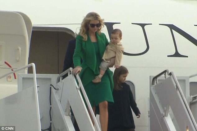 Made it! Ivanka stepped off her father Donald's private plane holding her baby boy Theodore while Arabella walked behind her 