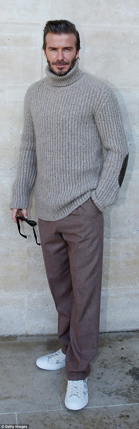 Cosy: He wore a comfy knitted jumper with brown trousers and branded trainers