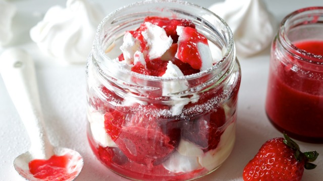 Eton mess with strawberry sauce.